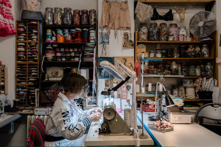 Person using sewing machine