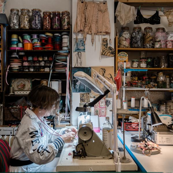 Person using sewing machine